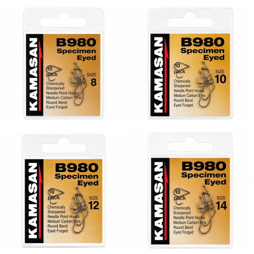Four packages of Kamasan B980 Specimen Eyed fishing hooks in different sizes.