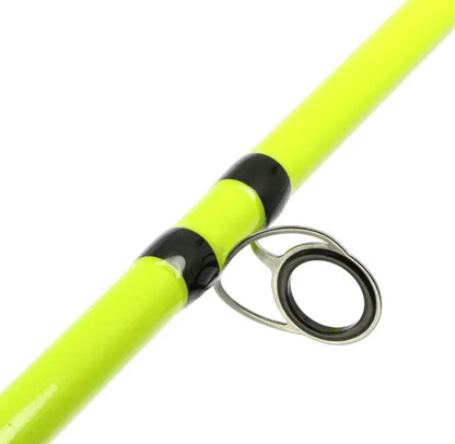 Close-up of a yellow fishing rod with a silver reel on a white background