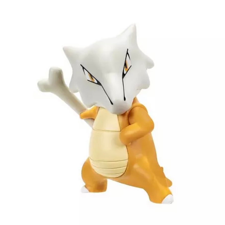 A toy figurine of a white and orange Pokémon character with a bone raised in its right hand, shown against a plain white background.