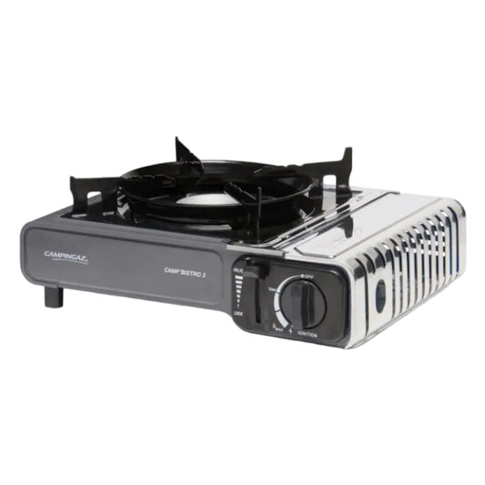 A portable single-burner camping gas stove with a black burner pot and control panel, featuring a silver ribbed metal side cover, shown on a white background.