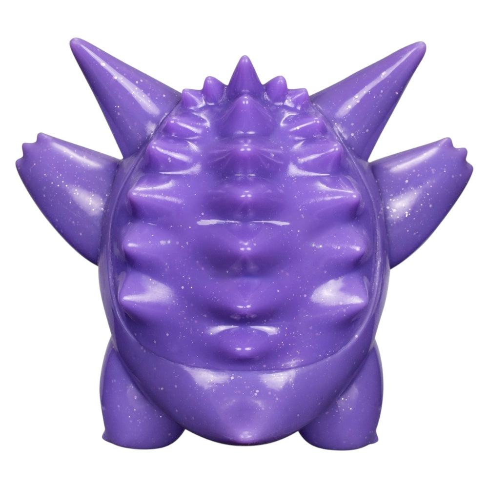 A purple, spiky monster-shaped object with a glossy, glittery finish, shown from the front against a plain white background.