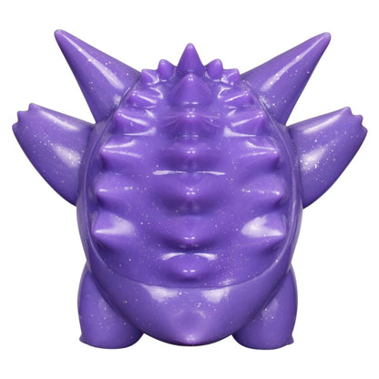 A purple, spiky monster-shaped object with a glossy, glittery finish, shown from the front against a plain white background.