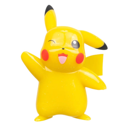 A yellow Pikachu figurine with a winking expression, one raised arm, and red cheek accents, isolated on a white background.