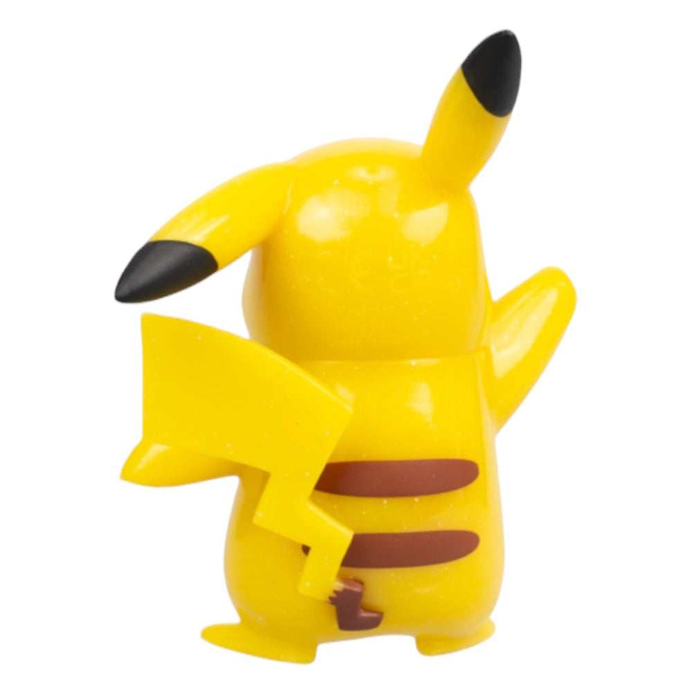 A yellow Pikachu figurine shown from the back, featuring its signature black-tipped ears and tail, brown stripes on its back, and a lightning-bolt-shaped tail, set against a plain white background.