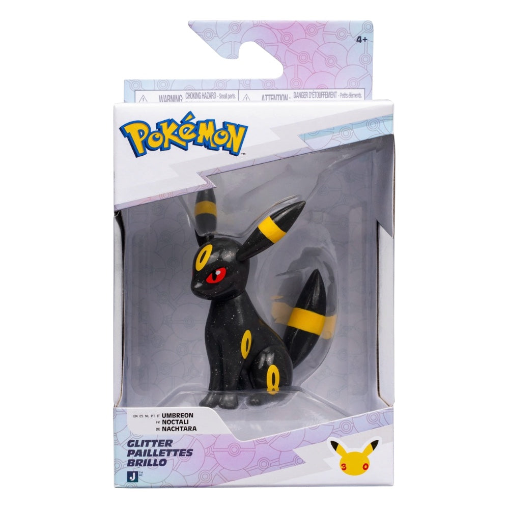 Pokémon Glitter Paillettes Brillo Umbreon figure in its original window box packaging, featuring a black Umbreon with yellow stripes and red eyes.