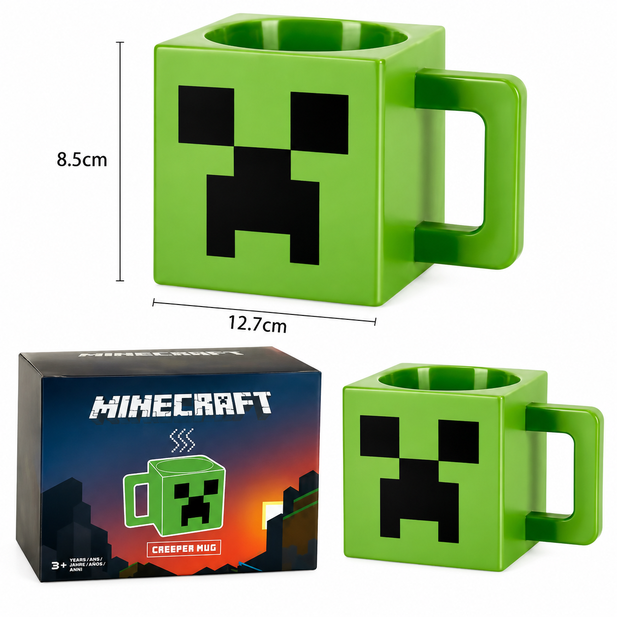 A Minecraft Creeper mug shown in green with a black pixel face, alongside its retail box and dimension callouts indicating 12.7 cm width and 8.