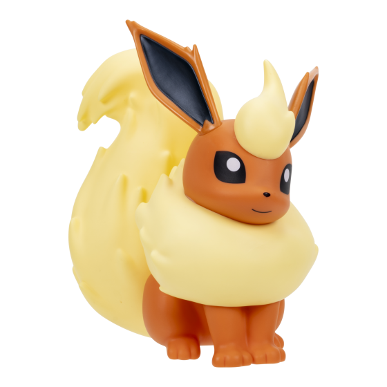 A small collectible figurine of a Fire-type Pokémon, resembling Flareon, in a sitting position. The figure features a warm orange-brown body, a large fluffy cream-yellow underbelly, and a matching cream-yellow crest on its head, with dark navy inner ears.