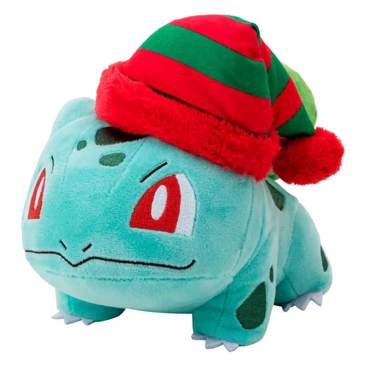 A plush toy of Bulbasaur wearing a festive red and green striped knit hat with a fluffy trim and pom-pom, set against a plain white background.