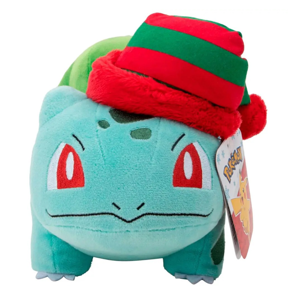 A Bulbasaur plush toy wearing a red and green striped knit hat, shown against a plain white background with its product tag attached.
